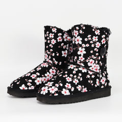 A pair of black slipper boots with cherry blossom prints in pink and white